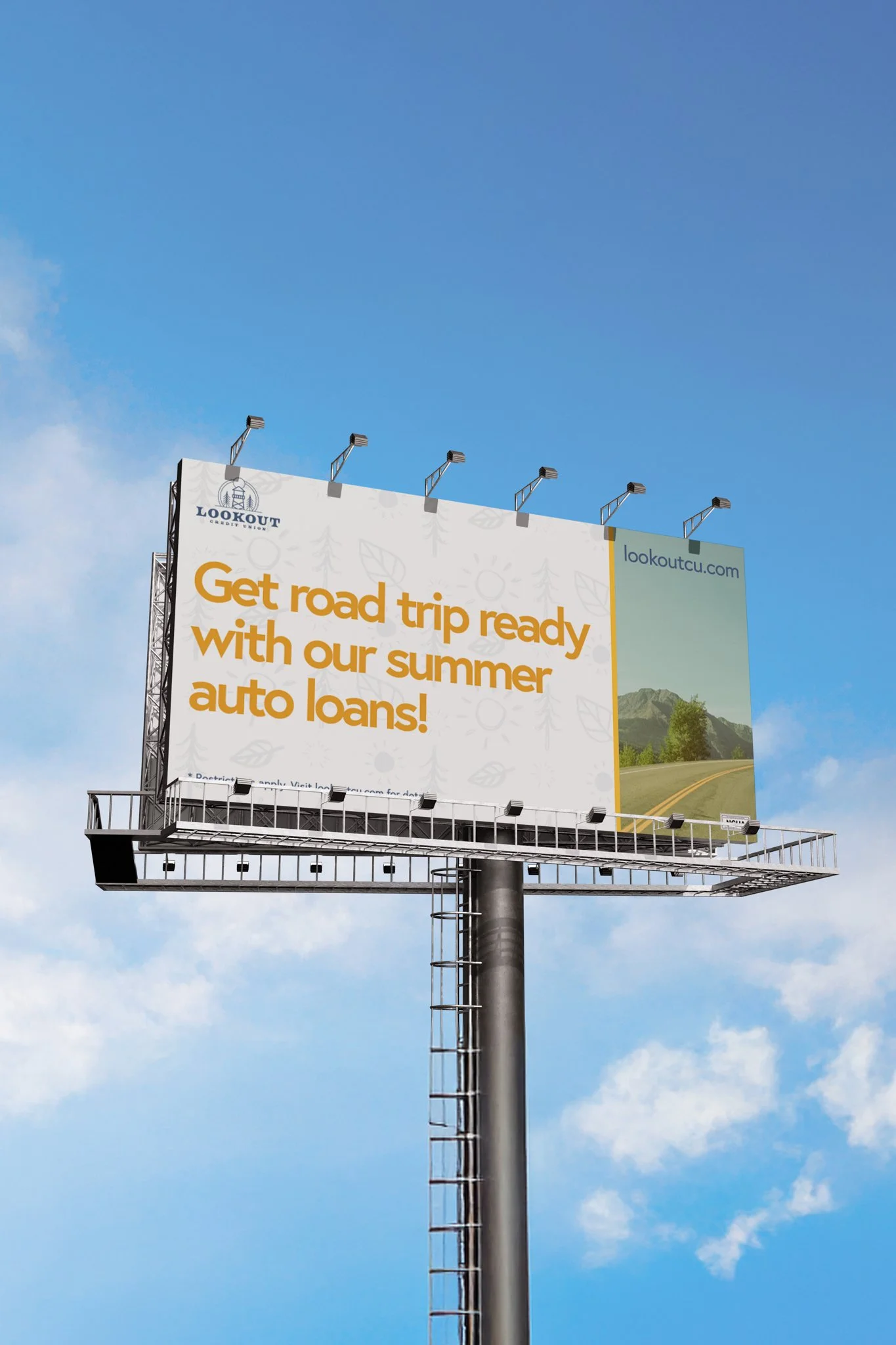 Billboard advertising summer auto loans with a background of a road and scenic mountains.
