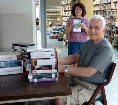 Jill and Allen prepare audio books for sale.