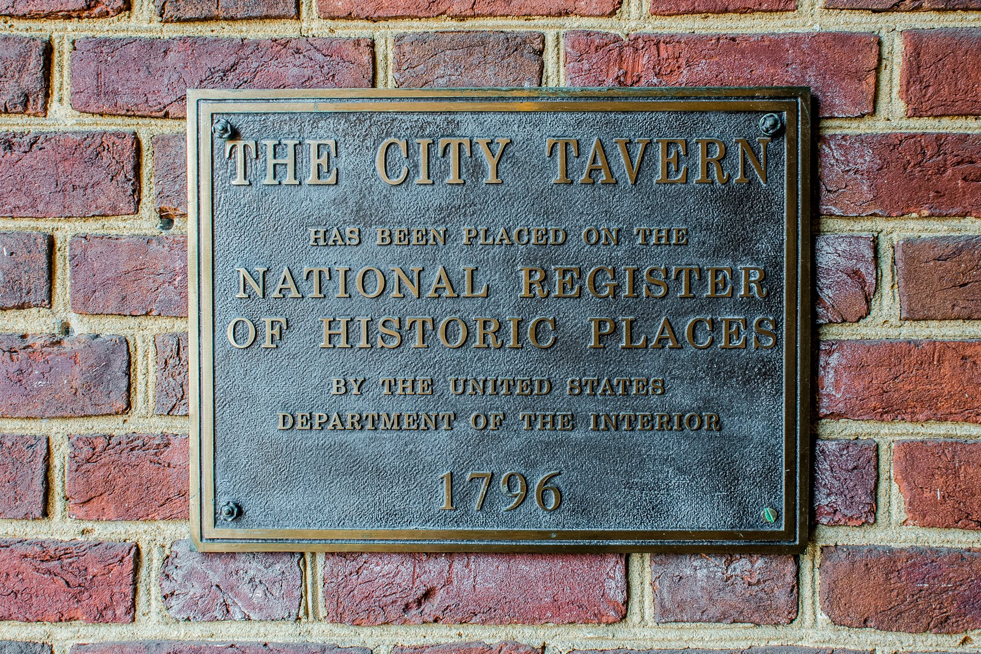  The historical marker plaque,   via   