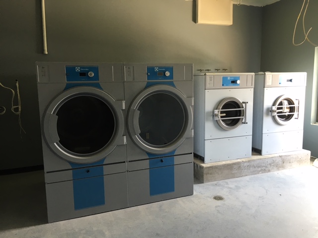 Two T5675 83 lb dryers and two W5280X 65 lb washers. The washers are 300 g-force to help extract more water before drying.