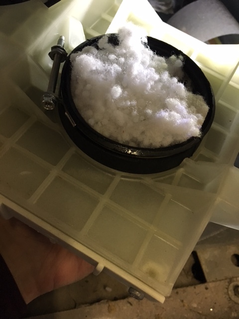 Here is a Wascomat drain after a pillow exploded in the tub. Fix was to just pull the nylon pillow filler out of the drain and fish more of the pillow filler from under the tub.