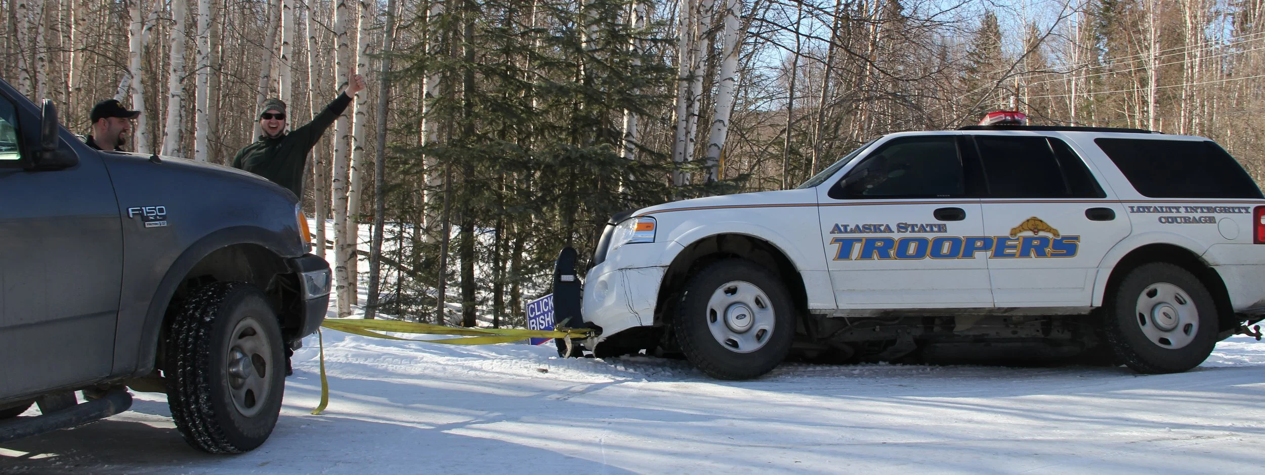 Sam is elated as we pull the State Trooper out of the ditch.
