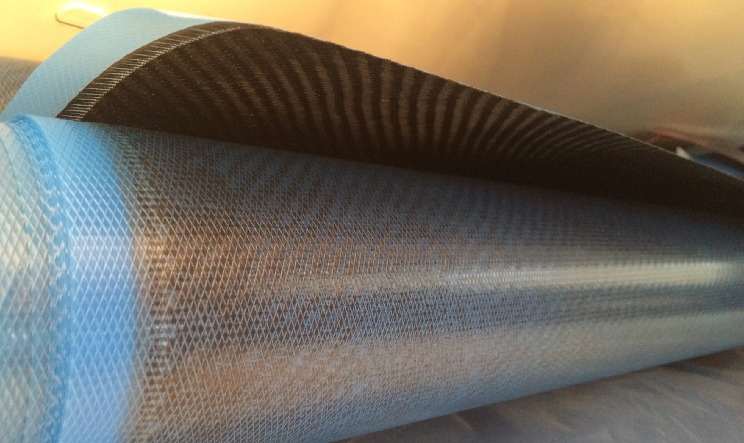 Carbon fiber comes to the shop in sheets, ready to be cut.