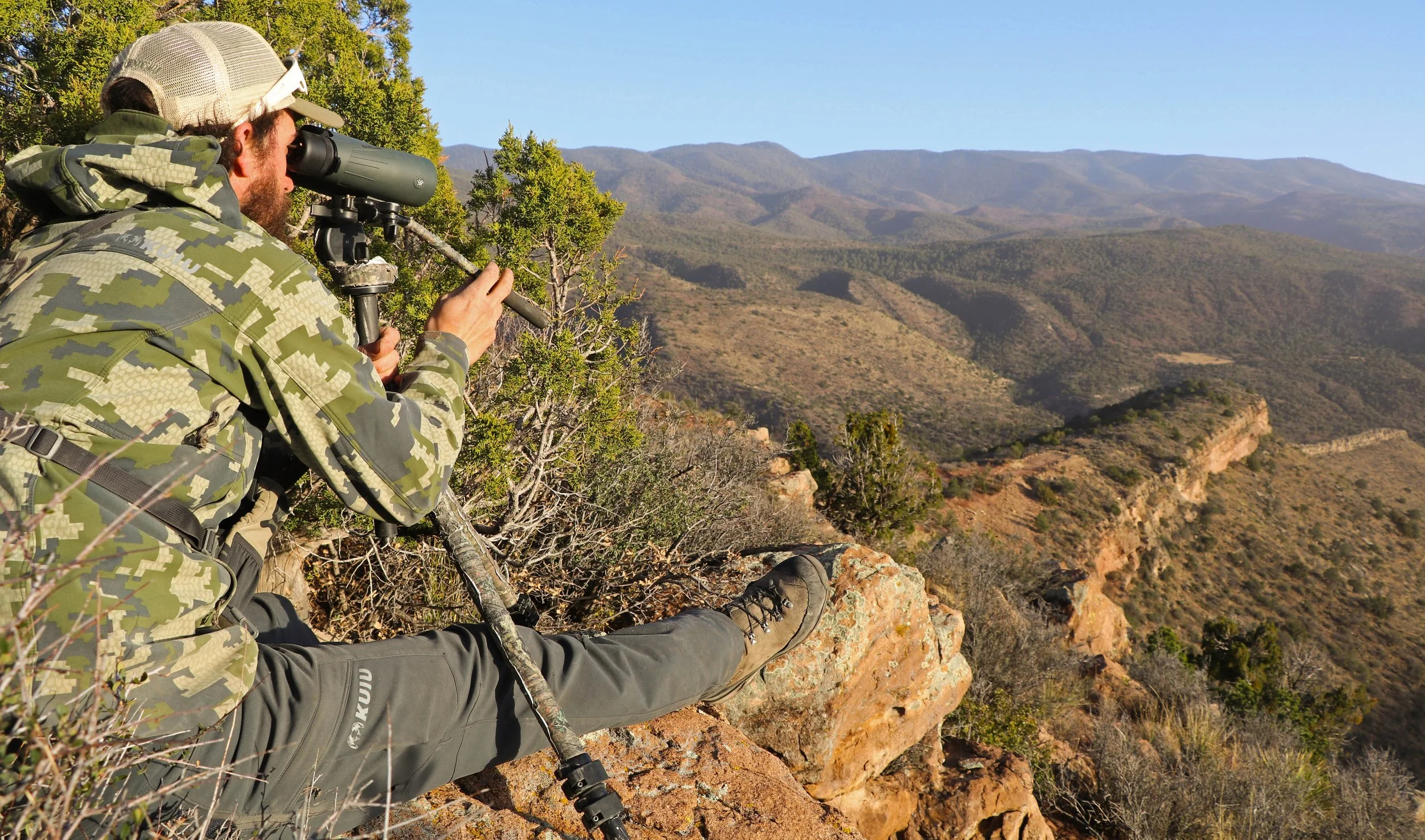 Adam behind a pair of 20x Kaibab binoculars.