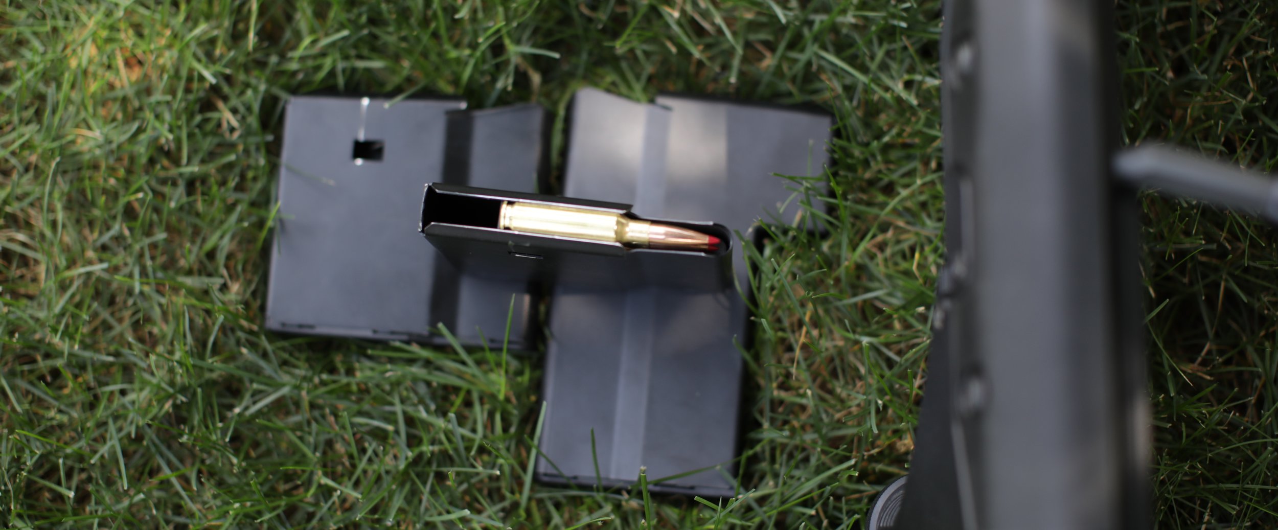 The SRS mags are single stack, made of steel, and not all that user friendly. But they are tough.