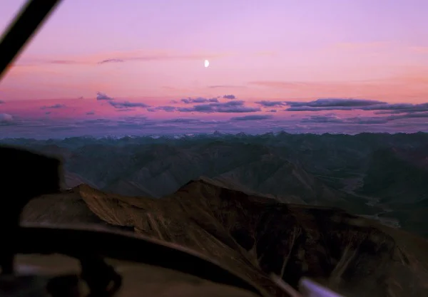 Sunset over the Mackenzie Mountains from the window of a float‐plane.