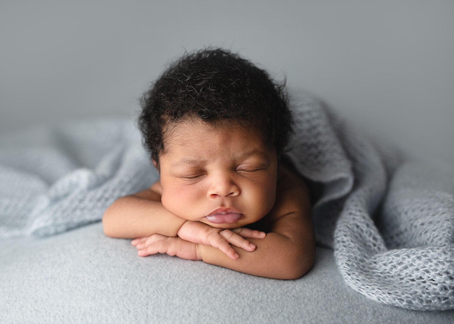  Beautiful baby boy chin on hands pose Winnipeg Newborn photography session 