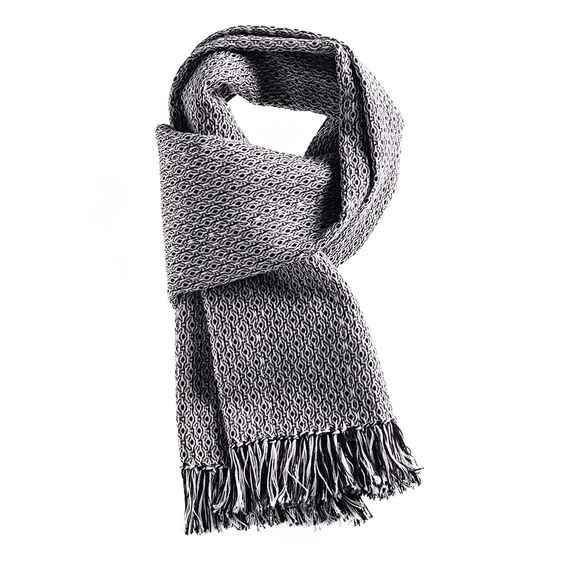 Occhietto scarf handwoven by Brozzetti of Perugia. Black and white silk and cashmere cotton blend with hand knotted fringes.