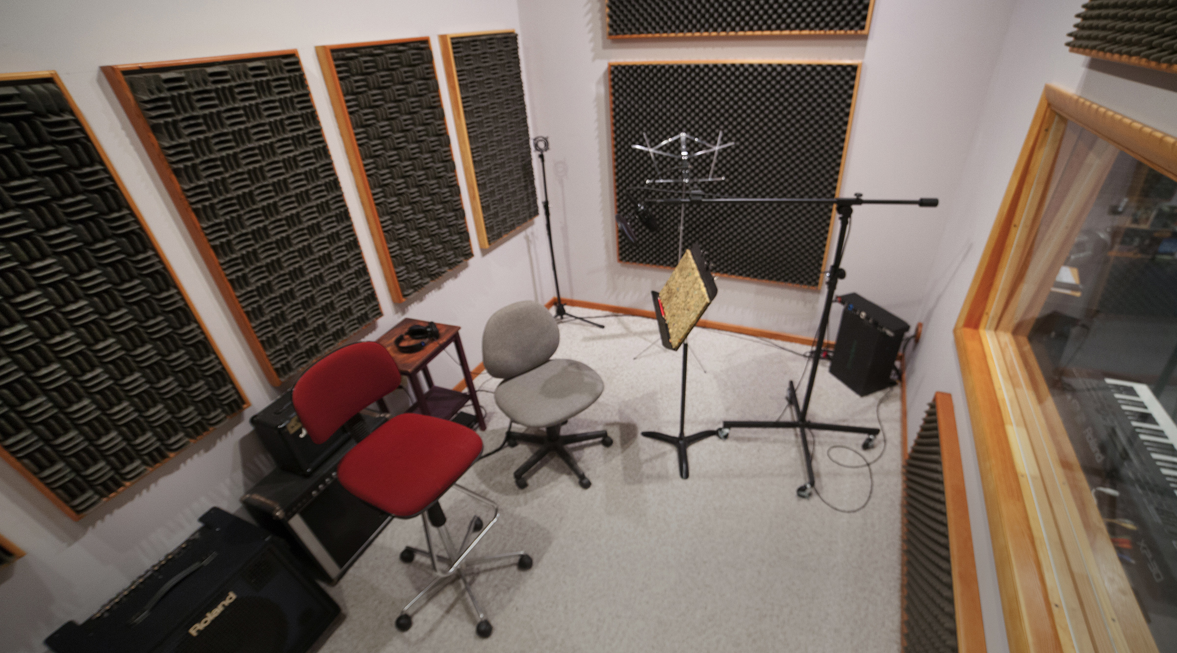 Our recording room is far larger than a typical narration booth, and far more comfortable. Custom built as a room-within-a-room-within-a-room, it’s dead quiet, and big enough for a string quartet or a very large drum kit. It’s tunable - the Sonex® panels on the wall are removable so we can get just the right brightness, and we also have Sonex partitions that can separate performers so they can work together but be recorded cleanly on separate tracks. The booth is also fitted with custom-built silent ventilation, so the air conditioning or heating can keep the room at just the right temperature, even while recording. We weren’t kidding about “comfortable”.
