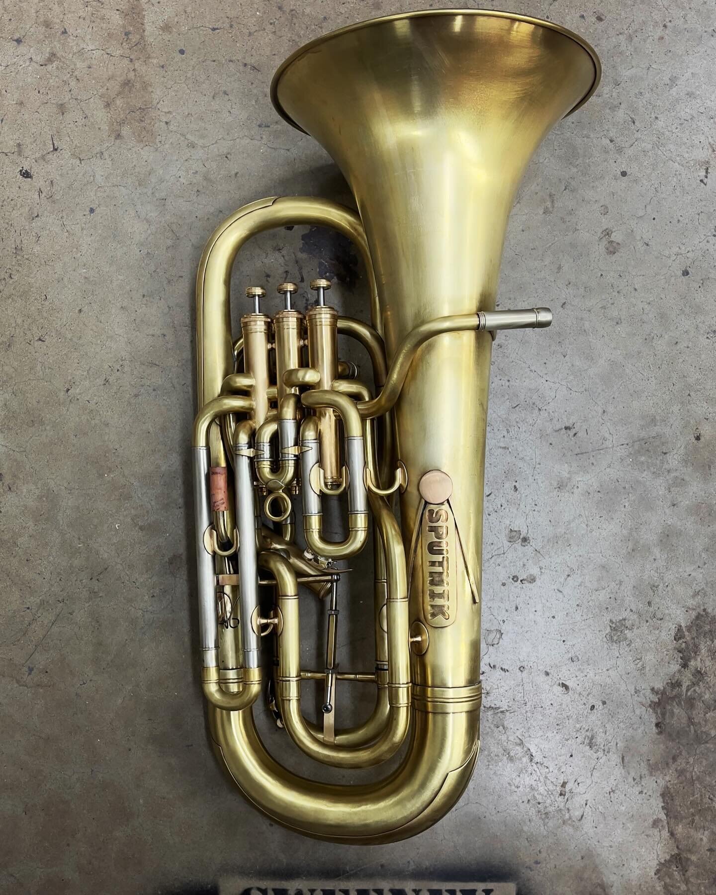 Sputnik, the euphonium. Refurbished and modified with main tuning slide trigger mech and custom name plate, all made in house. 

#SweeneyBrass
#strip 
#quality
#shopcat
#custom
#patina
#trombone 
#basstrombone 
#doneright 
#modification
#rebuild
#cus