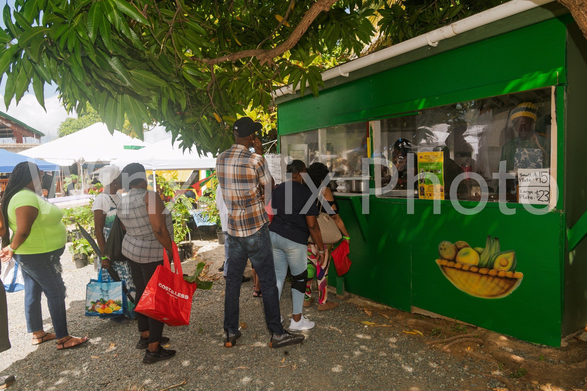 Farmer Zimba of Yabba's Ital with Line of Customers.jpg