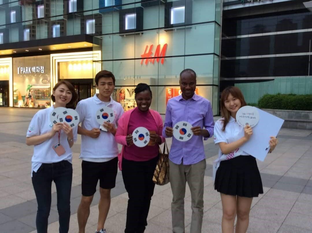 Sellah King’oro (Kenya) and David Normanyo (Ghana) sharing a smile with students from a University in South Korea
