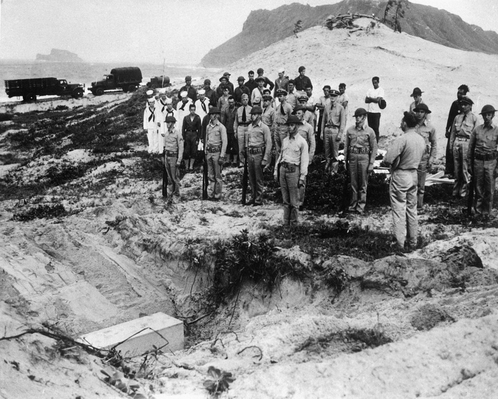 The body of a Japanese Lieutenant who crashed during the attack on Pearl Harbor is buried with full military honors by U.S. troops..jpg