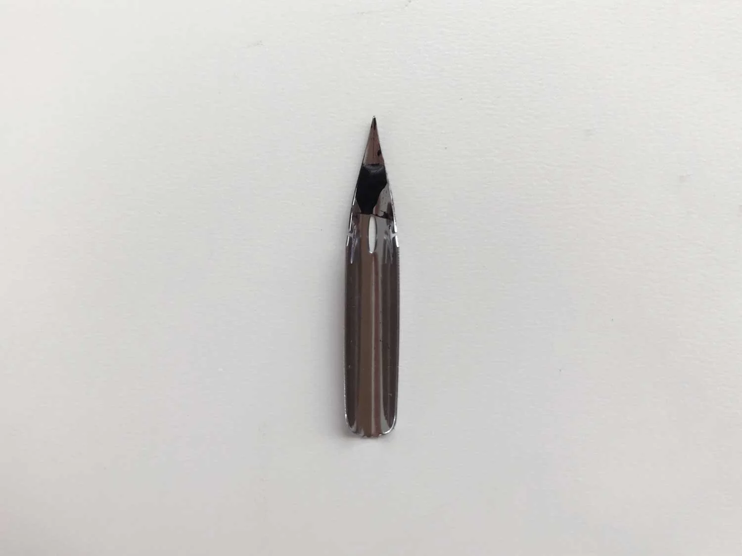Above: How what it looks like when a new nib is dipped in ink without having the protective coating removed.