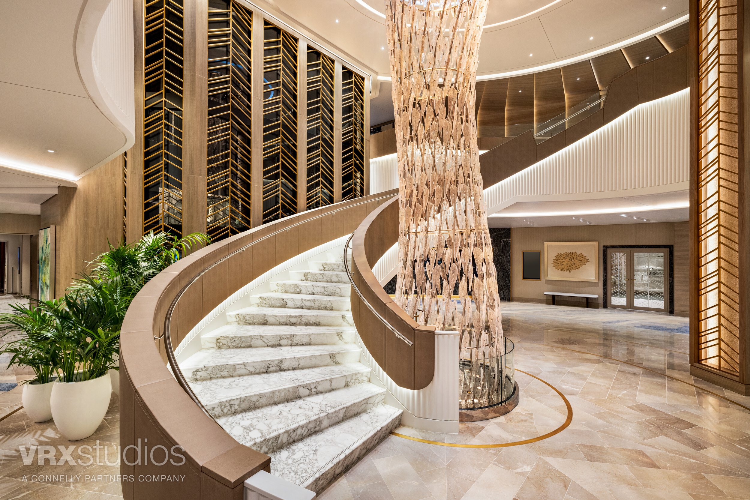Luxury cruise ship atrium interior with chandelier and staircase on Oceania Vista