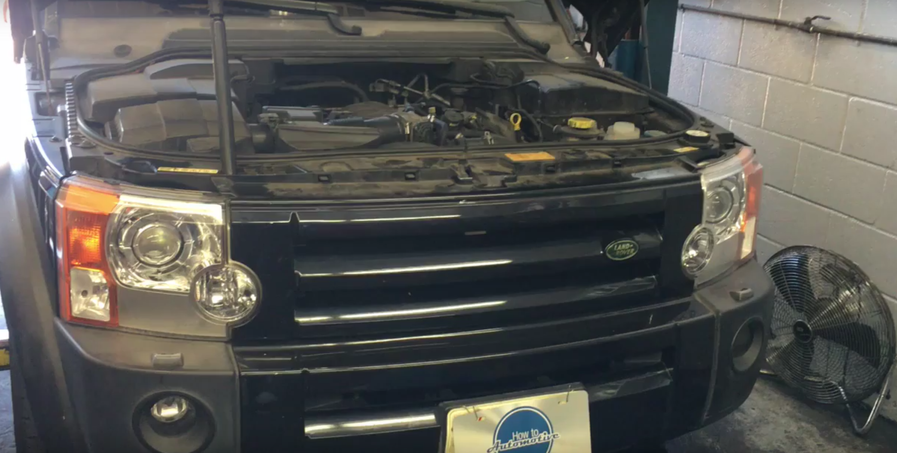 How to Replace the Thermostat Housing on a 2005 Land Rover LR3