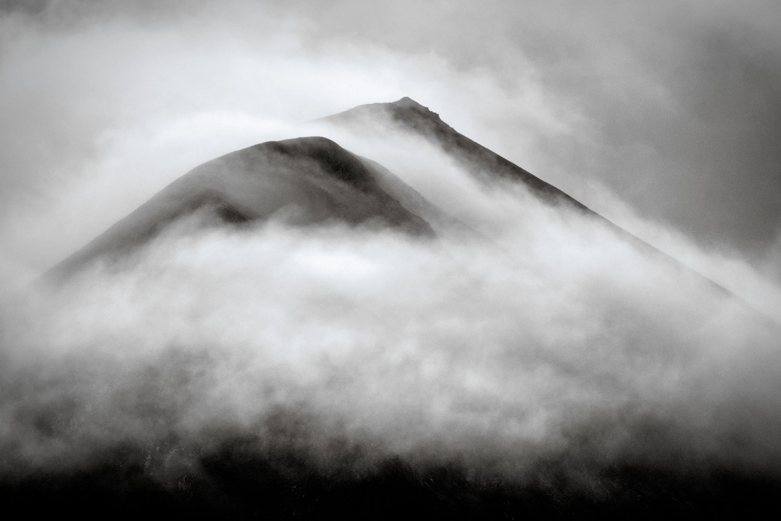 Marsco Rising. The head of Marsco, a mountain in the Cuillin range on the Isle of Skye in Scotland, rising above the cloud that wreaths the lower reaches of the mountain..