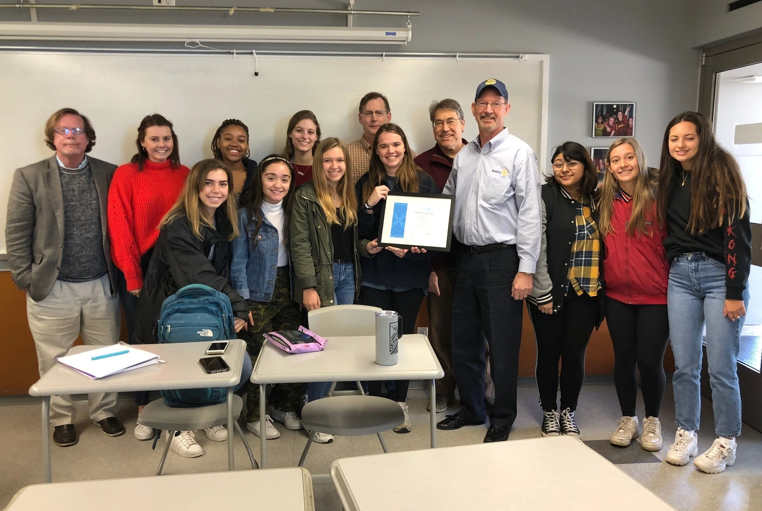 Westlake Rotary presents the newly formed St. Stephens Interact Club with their charter.