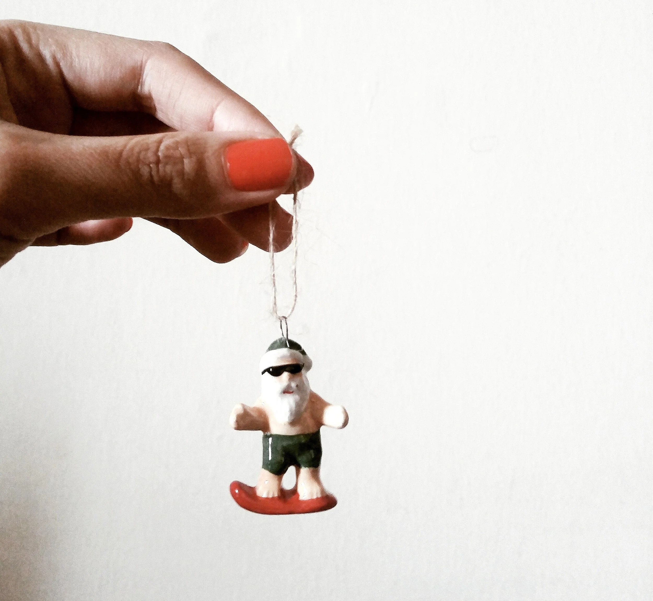 it's always sunny over here, if not the occasional rain! so naturally, Santa surfs ;) 
