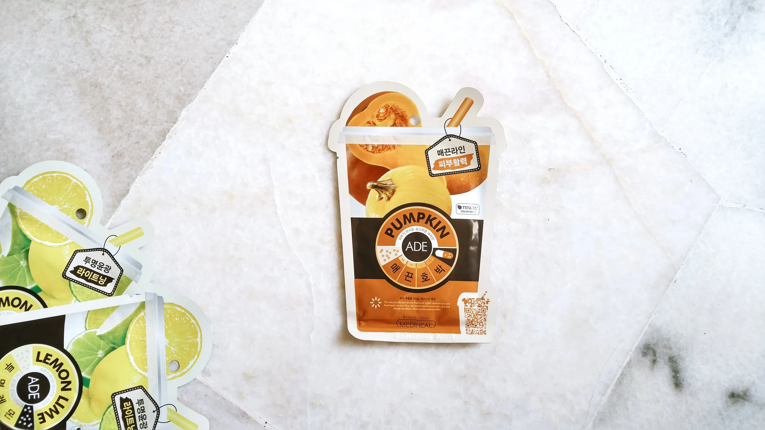 Mediheal Pumpkin Ade Mask. also in frame, the Lemon Lime Ade Mask from the same range. how cute is this cup-with-straw packaging? 