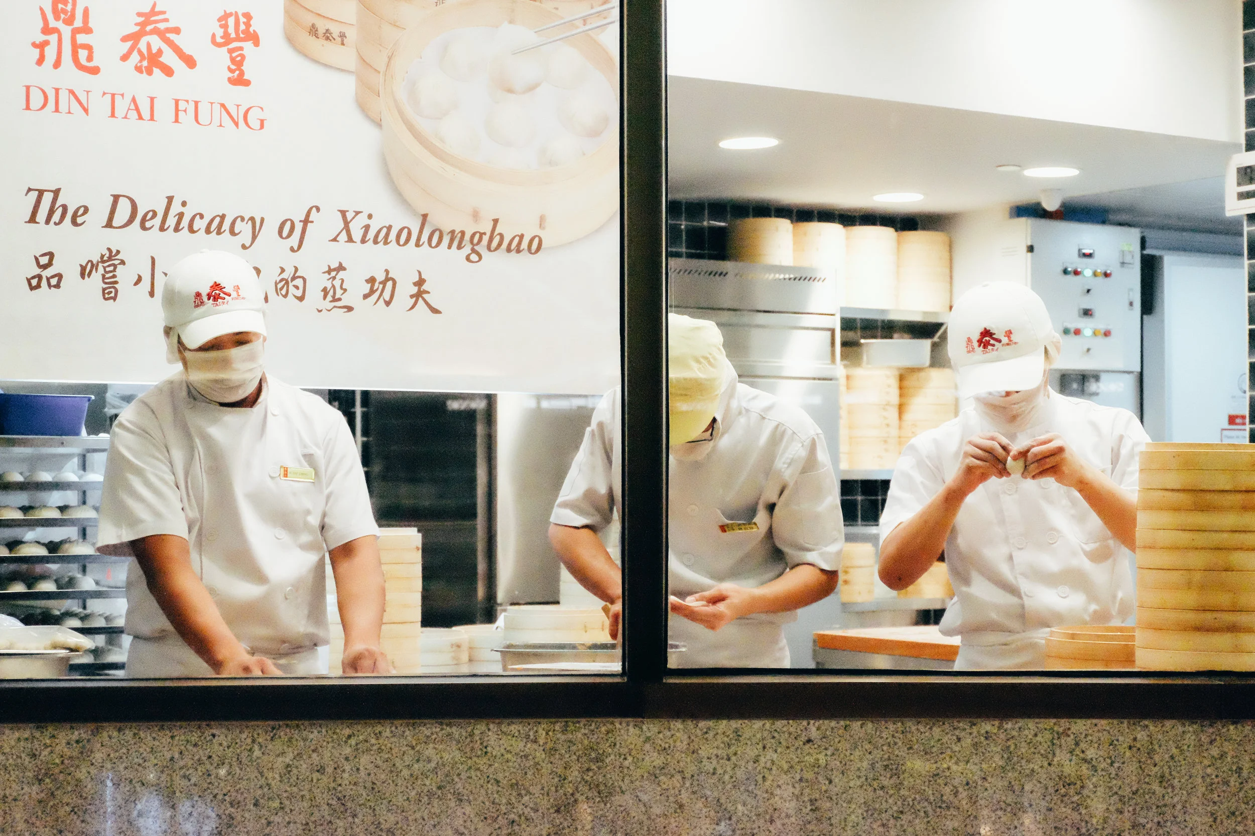 chefs making xiaolongbao at Din Tai Fung, a dimsum restaurant. this isn't an easy feat!