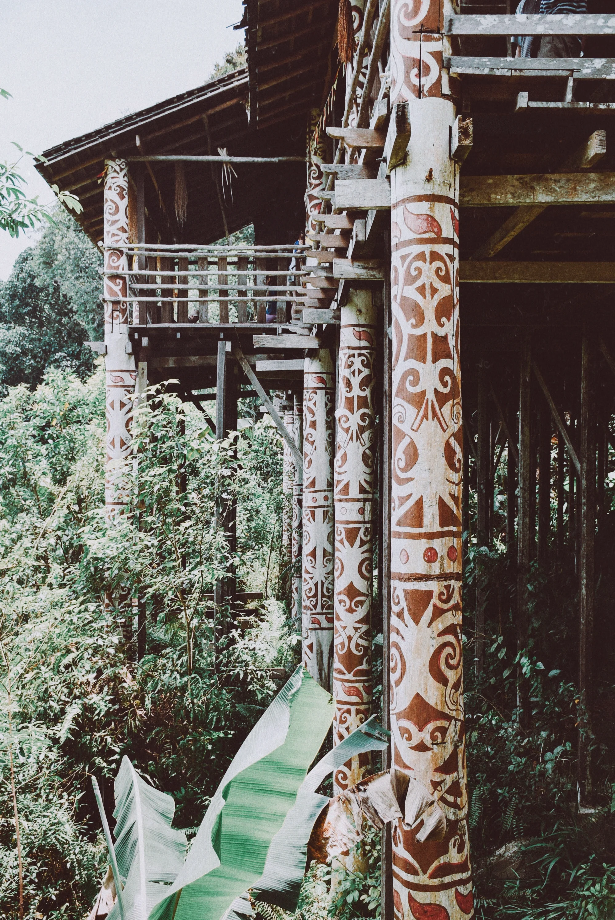 sarawak cultural village, 2015 the 'orang ulu' longhouse exhibit. pillars of the houses built in the mountains, carved with traditional motifs. i could almost imagine how my ancestors lived in these beautiful handcrafted houses. 