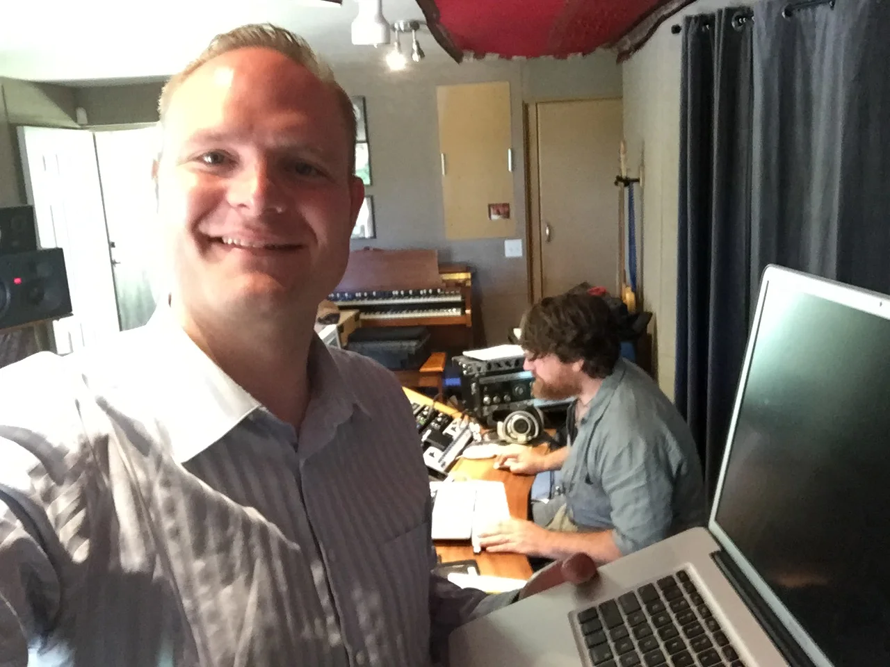 Peter smiles while the engineer works hard