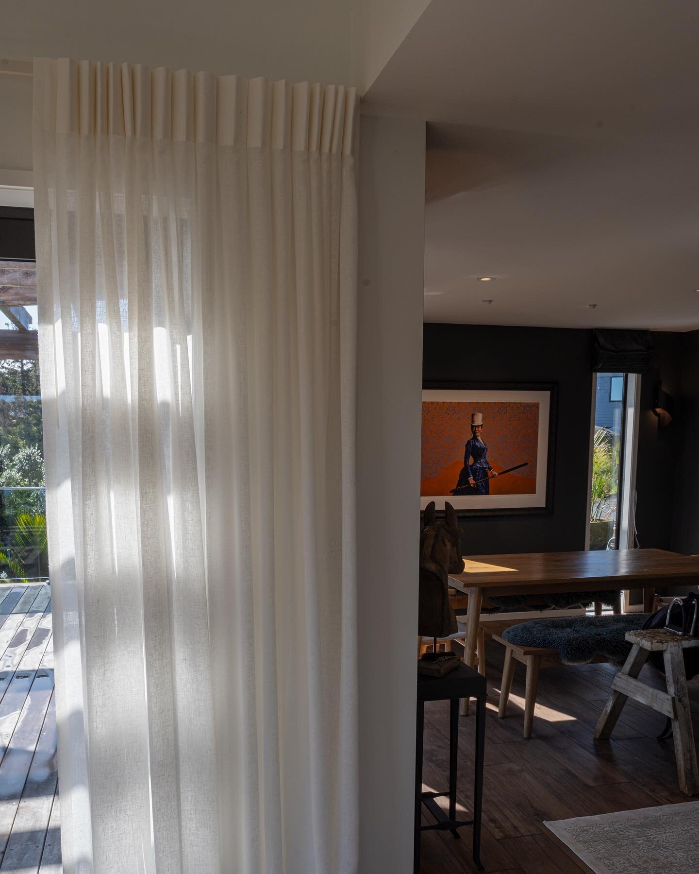 Beautiful pleated quality sheers in understated ivory going from corner to corner all around the living room providing shelter from the harsh sunlight and light reflection during the day &hellip;. A slight puddle on the floor makes these curtains loo
