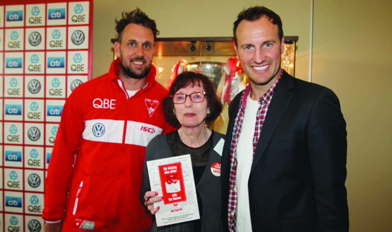 Author Jan Courtin poses with 2005 premiership stars Nick Davis and Jude Bolton. (Photo posted on the Swans webpage after the launch)