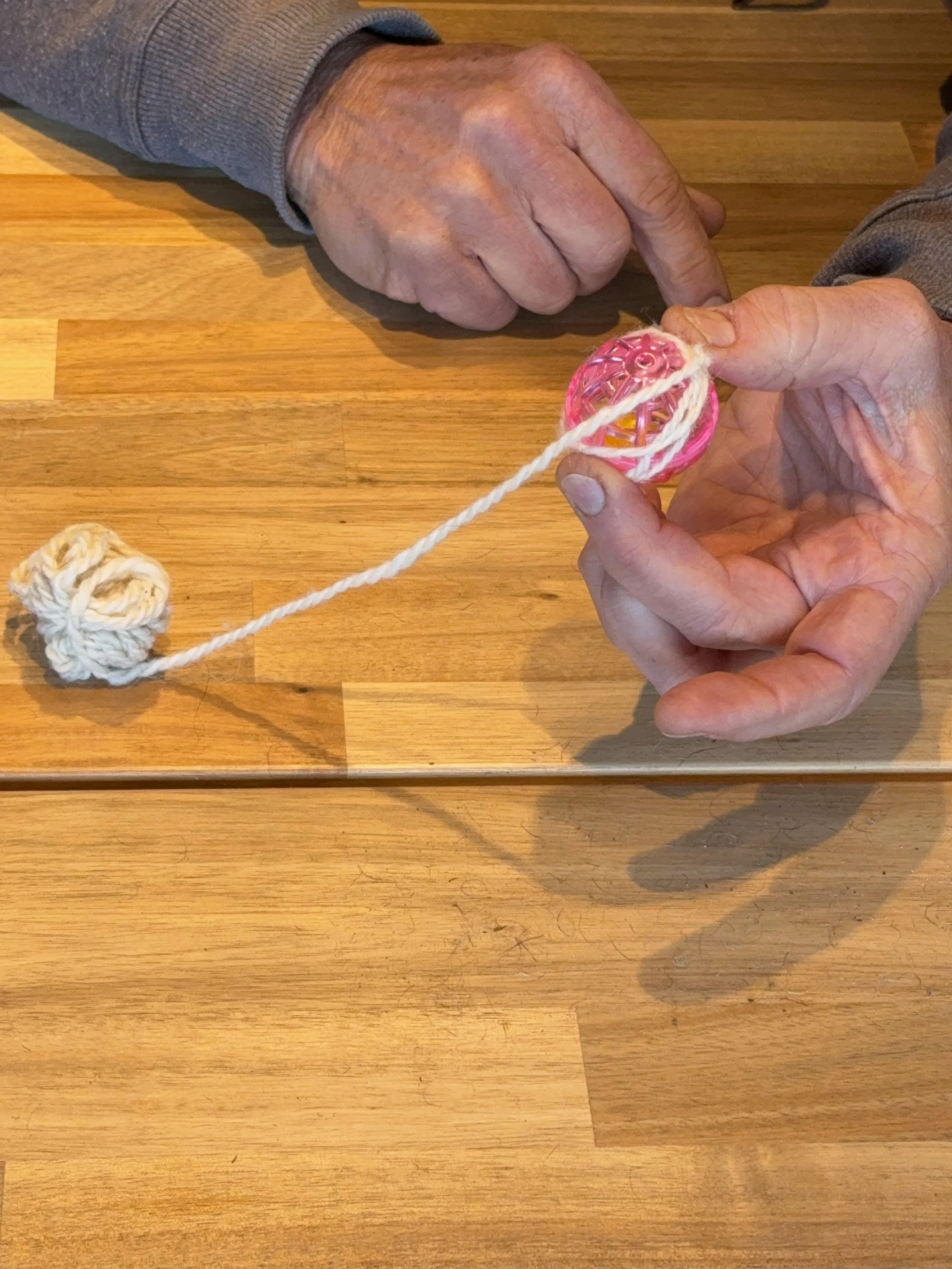 Winding yarn around the ball