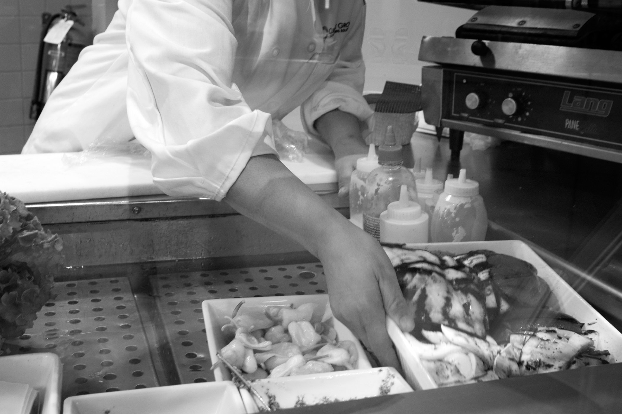 Evelyn at work in a corporate cafe several months before her promotion to sous chef. New York City (2014)