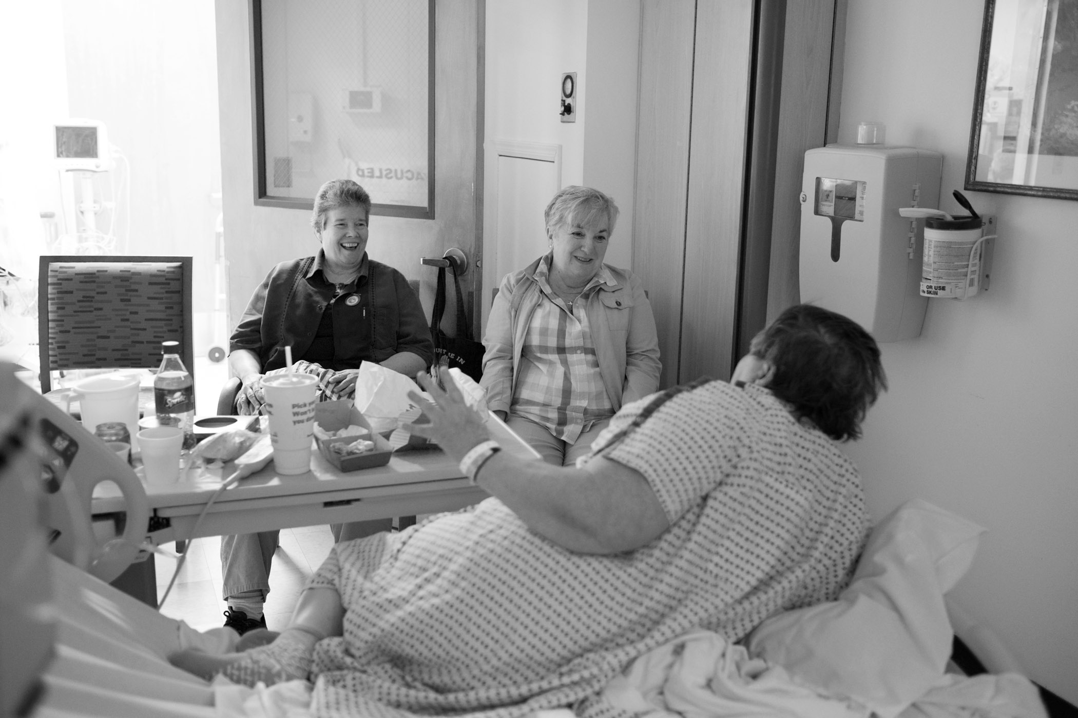  Carol with her friends Kelly (left) and Tina, after being admitted for treatment for heart disease. Mount Sinai Hospital, Long Island City, NY (2015)