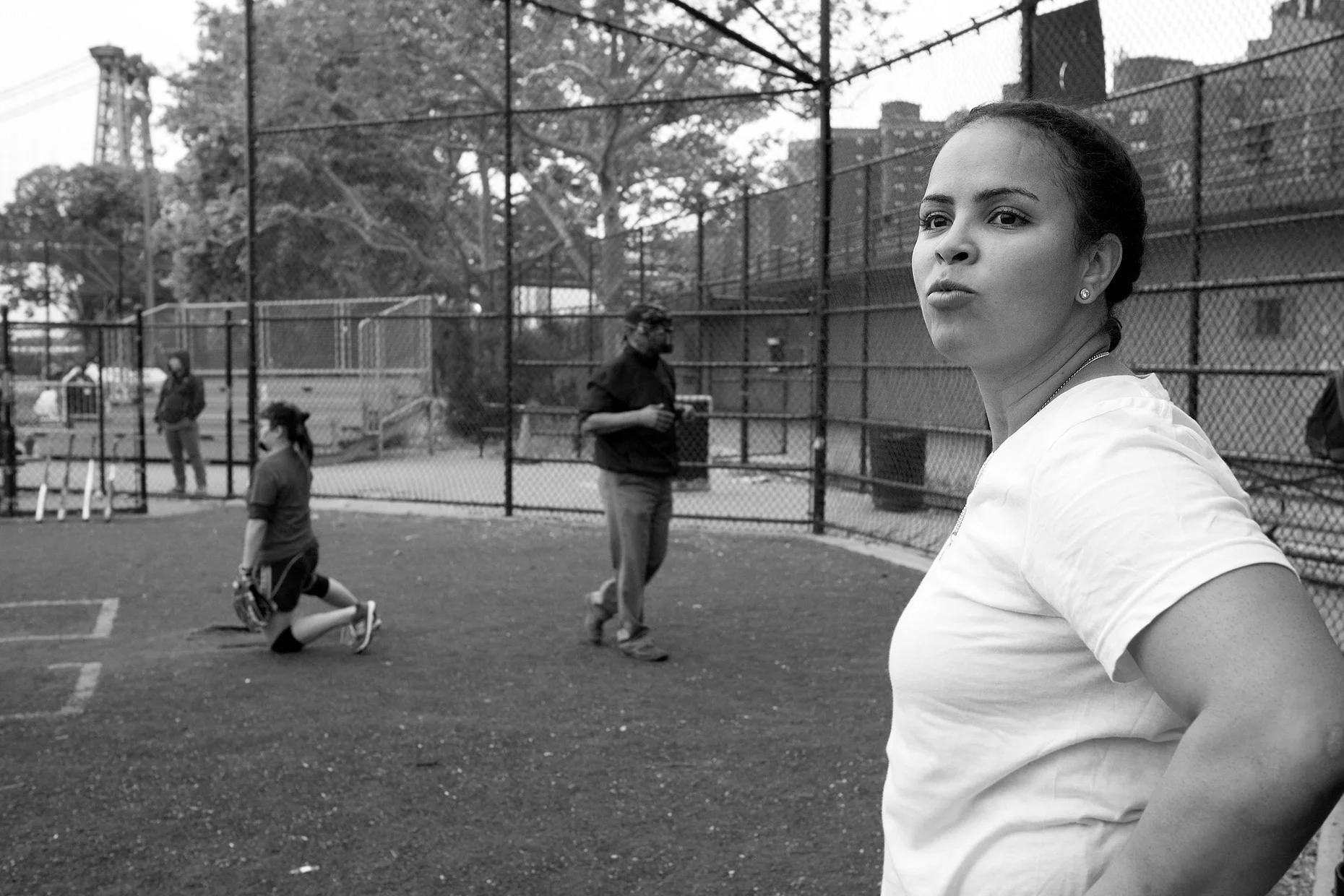 Evelyn, the only woman member of a baseball team which frequents her cafe. East River Park, New York City (2015)