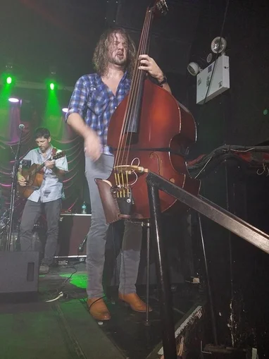Ricky B plays the upright bass photo by Sandi Atkinson.
