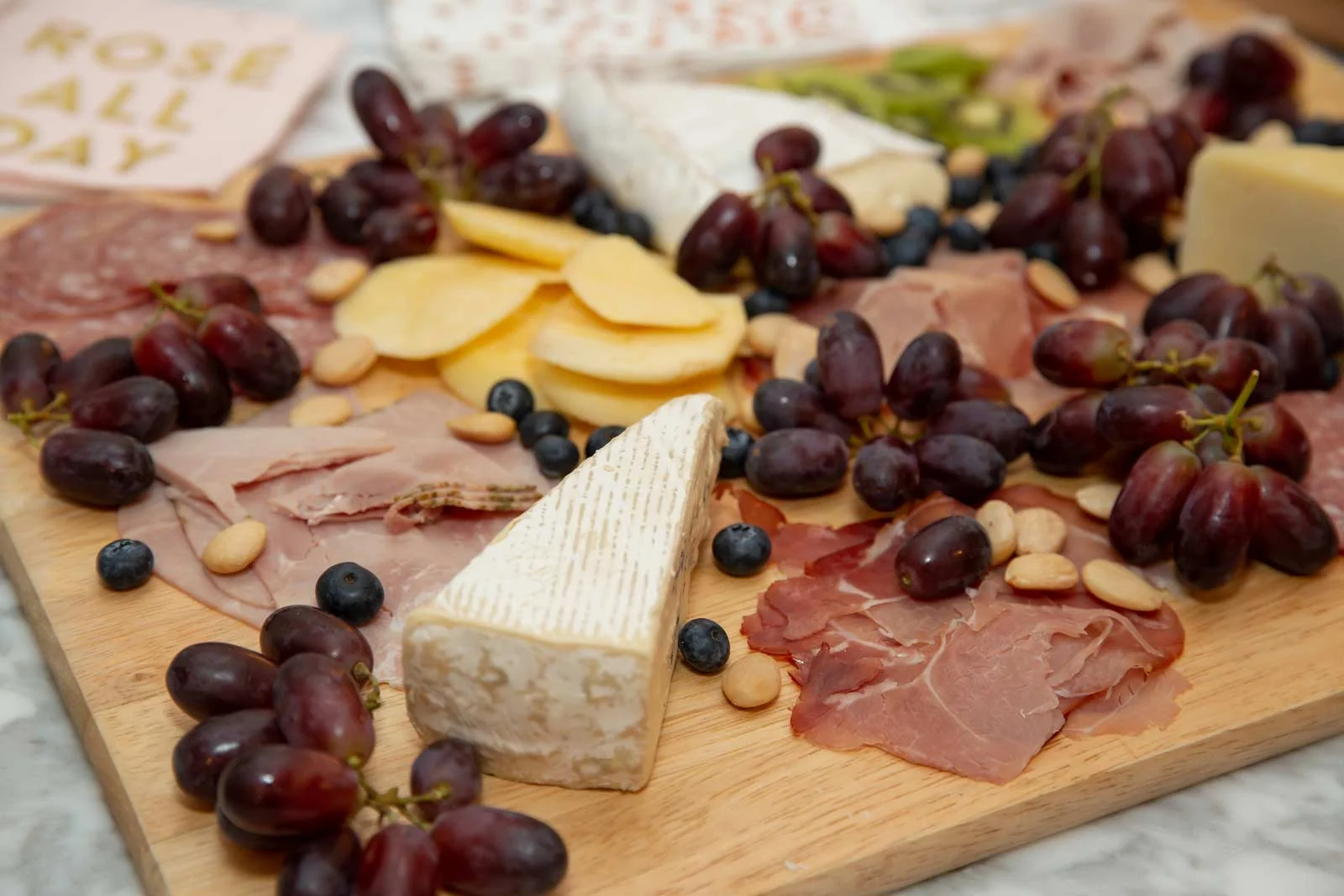 Delicious fruit, nut, meat and cheese platter created by Gina’s husband
