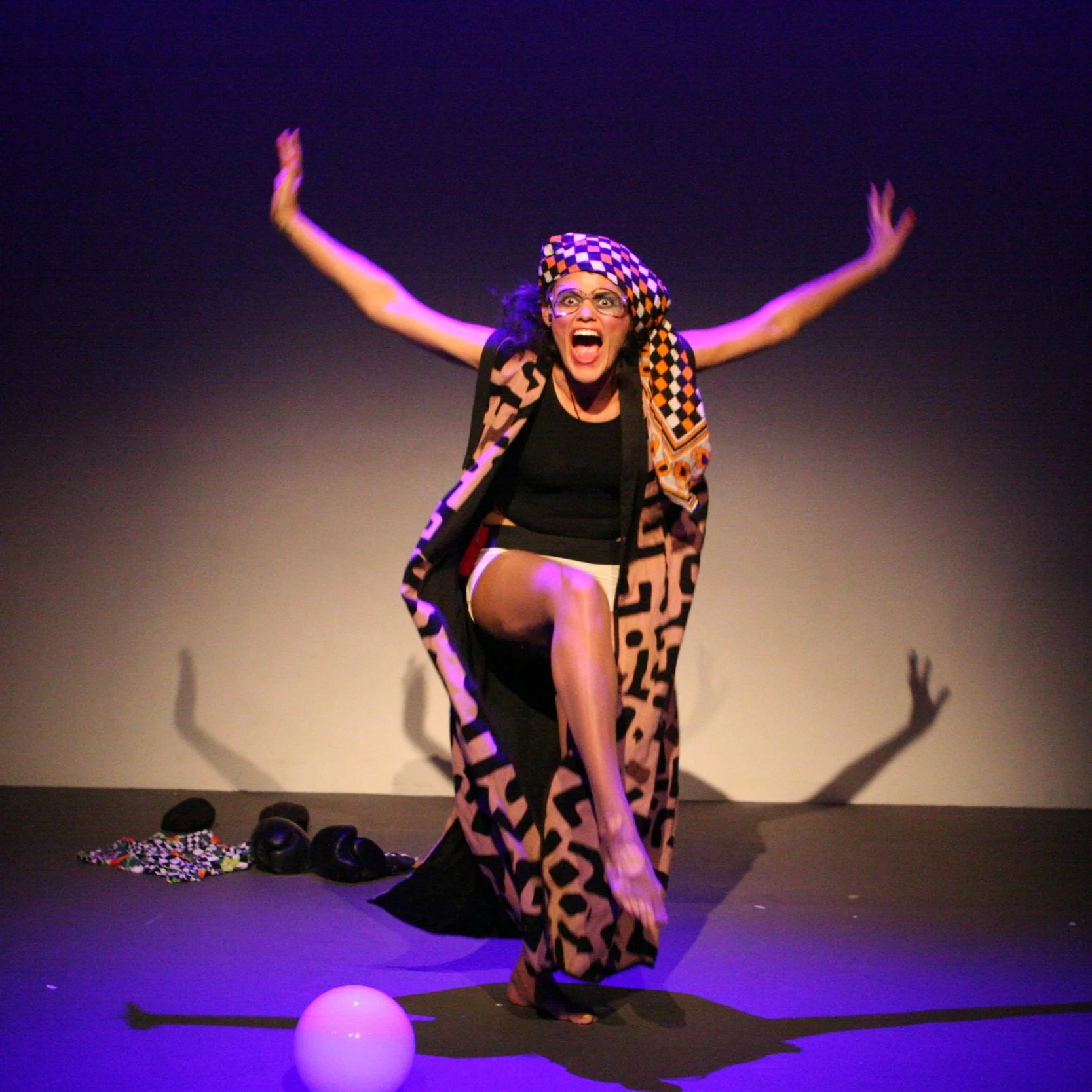 Dynasty Handbag creeps around the stage in sleuthful vengeance as "Detective Bags" who is on the search for a missing woman, or is it every woman...