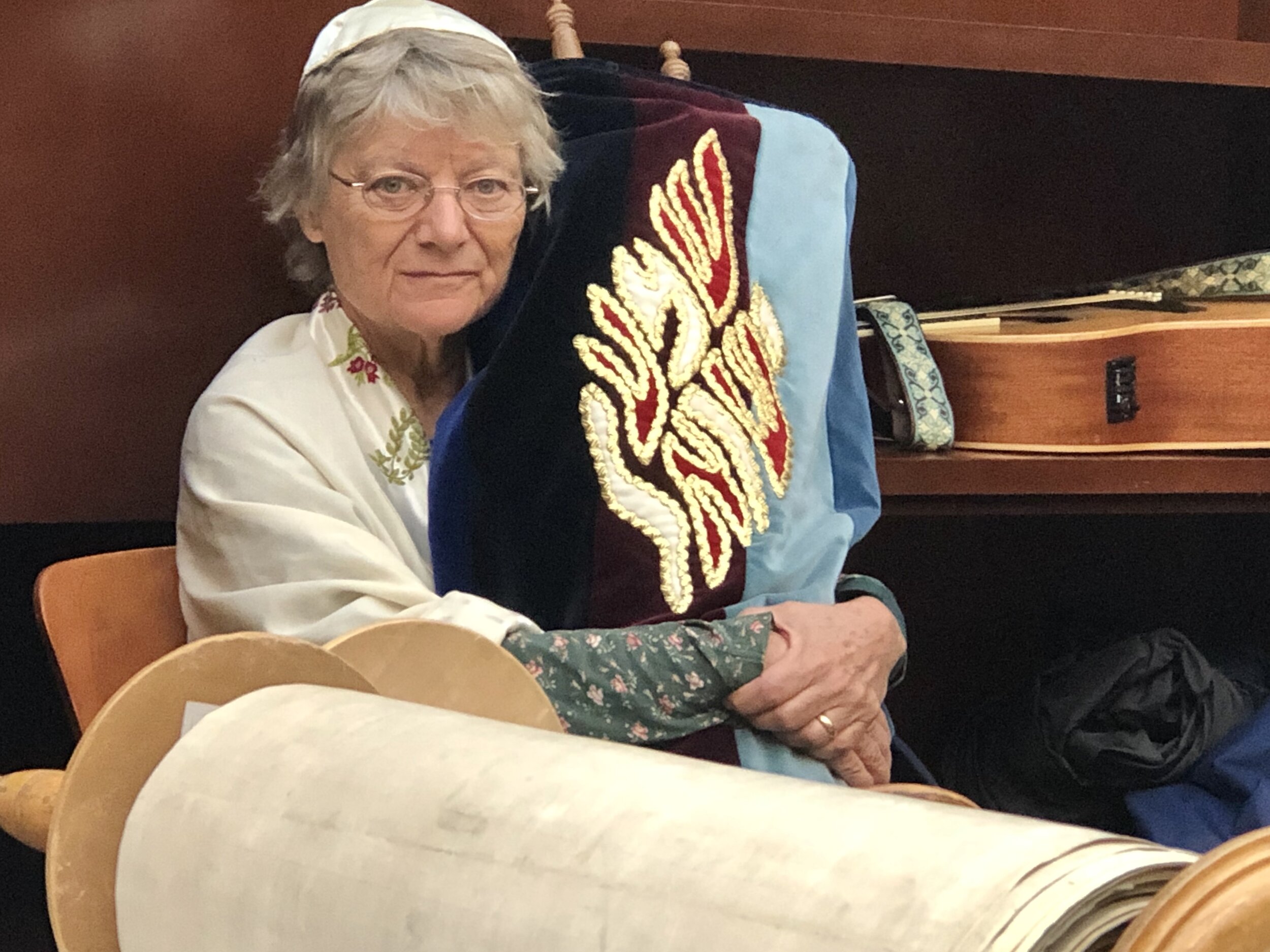 Lisa Wallis holding Torah seated.jpg