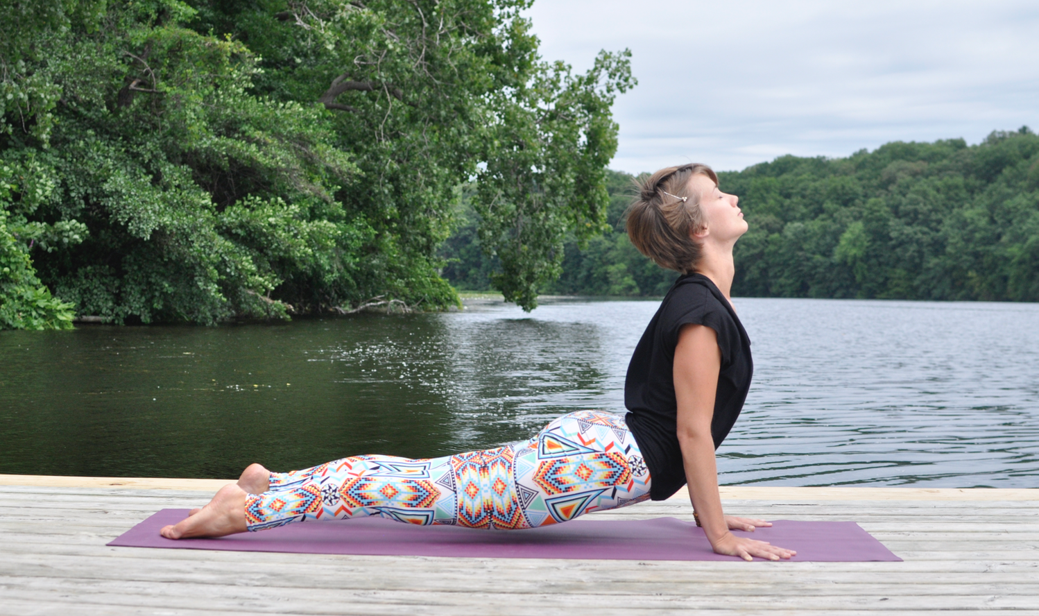 Upward Facing Dog, or Urdvha Mukha Svanasana, is a pose I enjoy and avoid because it is a ton of work and yet I feel so strong afterwards (like so much of yoga). Press the tops of your feet firmly into the ground and lift your kneecaps until your thighs are working A LOT! Draw your shoulder blades together and down your back to lift your chest and engage your spinal muscles. Press your hands down into the ground and drag them back towards your feet to move your chest forward MORE! Don't forget to breathe!