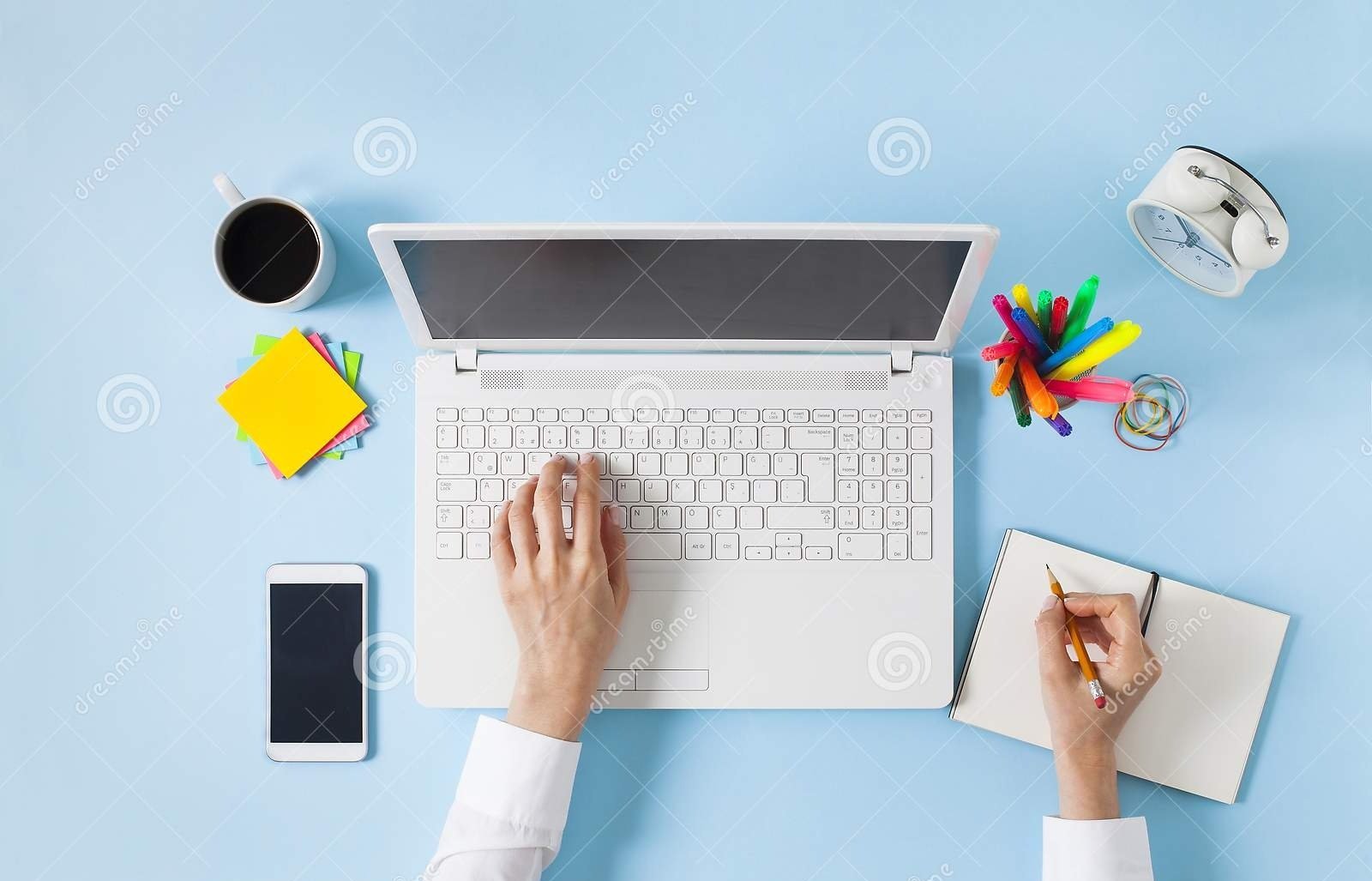 overhead-shot-woman-working-laptop-hand-taking-notes-to-notebook-computer-blue-table-top-view-flat-lay-design-161173455.jpg