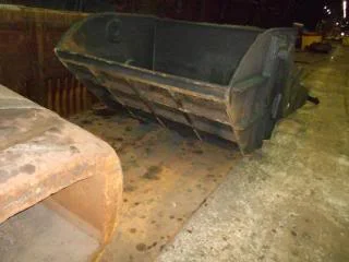 "A 'Crop Shear Bucket' that went into a pit at the 'Crop Shear' before #1 finish stand. The hot cropped ends fell down a large steel chute going into the bucket that was submerged below water."