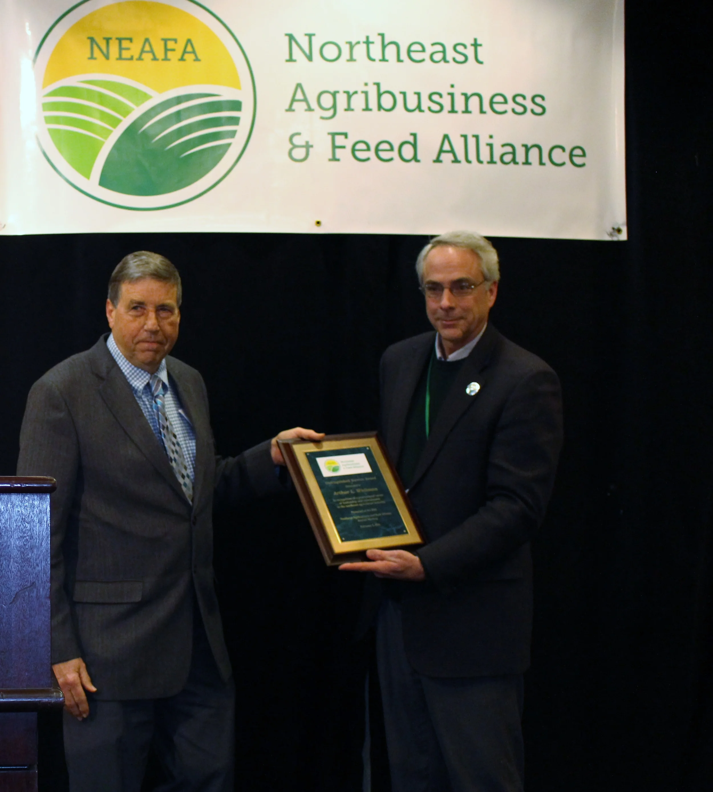 Art Whitman (right) receives the Distinguished Service Award from Alliance President, Rick Grant.