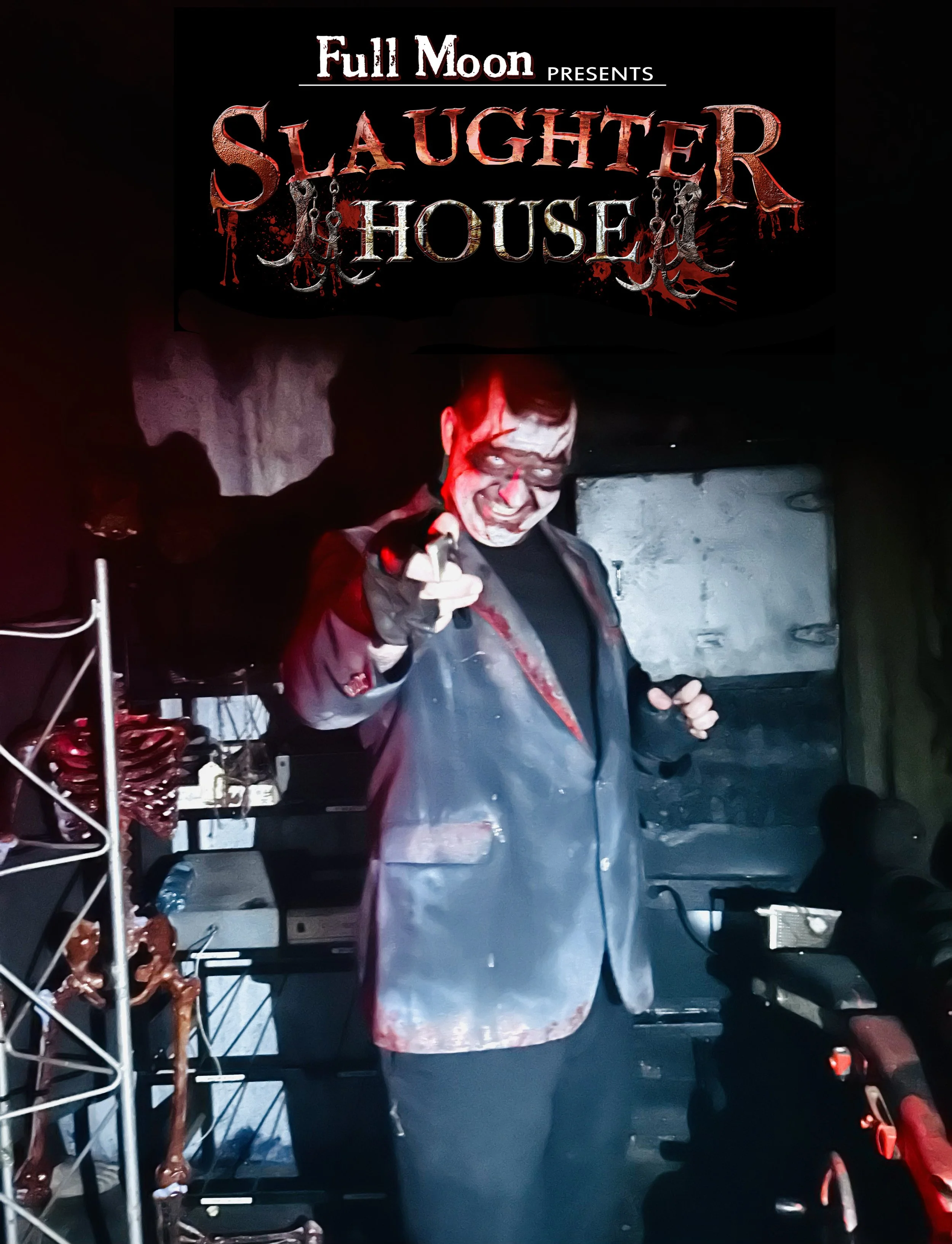 A person dressed as a sinister clown in a dark setting, wearing a painted face, black glasses, and a gray raincoat with bloodstains, pointing toward the camera. The background includes shelves with various objects, and a sign above reads "Full Moon P
