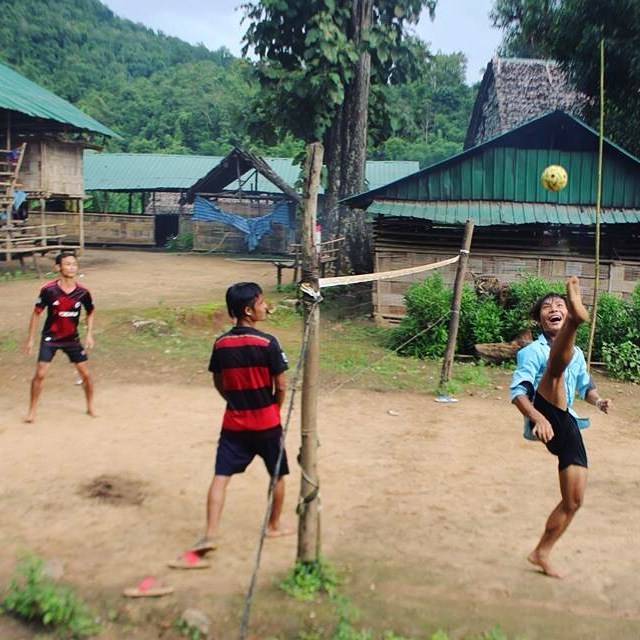 Sky high kicks.

This is a game of 'Chinlone'. The Burmese interpretation of volleyball played with your feet. The ball is woven from rattan, and makes a unique 'patpat' clicking sound when kicked. With the cramped conditions inside May La Oon refuge