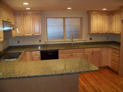 Remodeled Kitchen: cabinets, flooring, counter tops, window, appliances