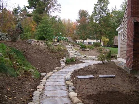 Concrete stepping stone walkway, site stone walls and steps