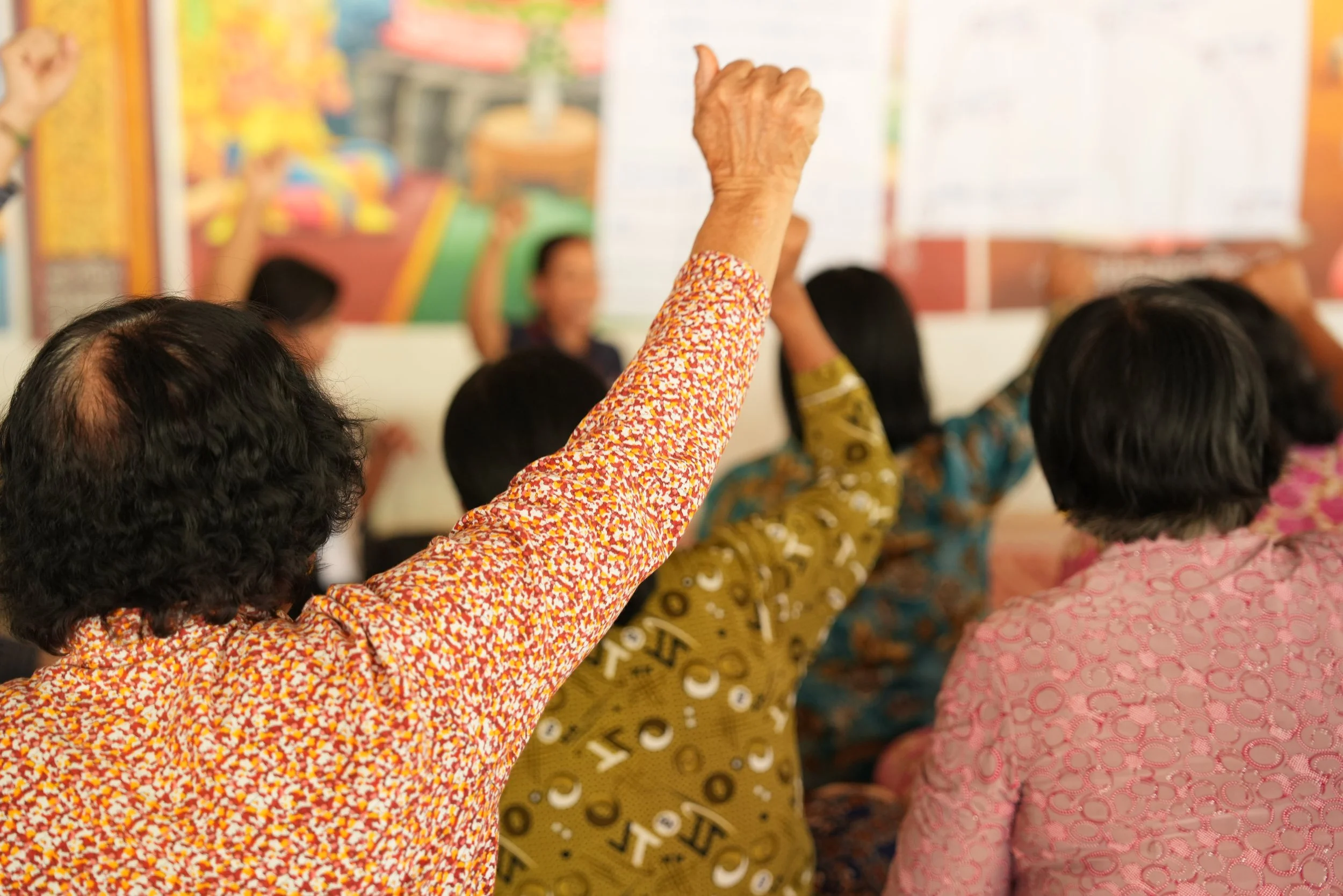 Woman holding hands up.JPG