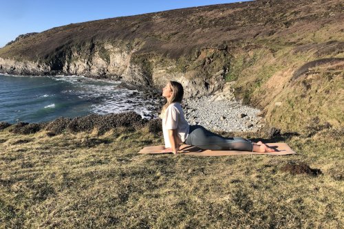 Wales-Adventure-Tours-UK-Yoga-Surf-Retreat-clifftop-upward-dog-500x333.jpeg