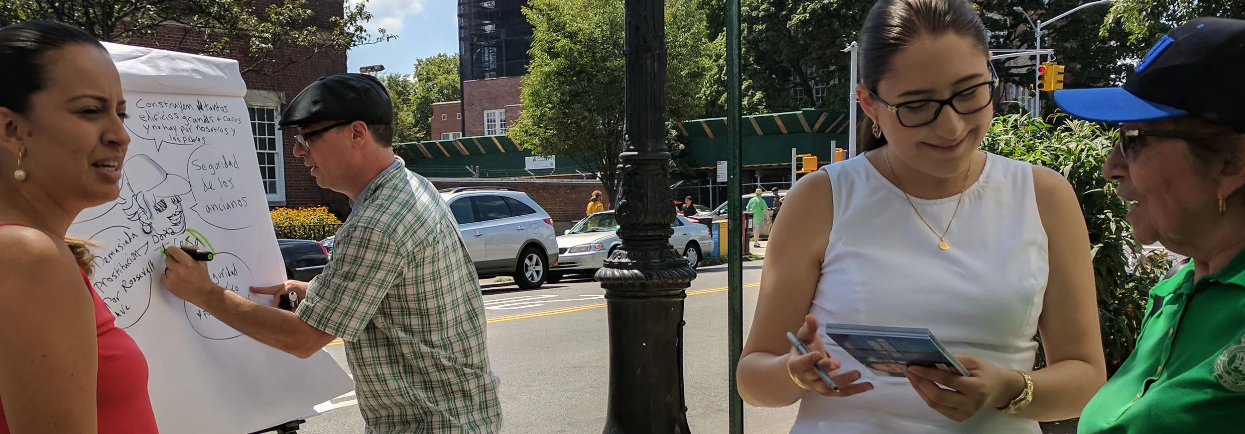 This is an action scene of candidate Catalina Cruz talking with voters on the sidewalk about issues that concerned them while I visually captured those concerns on a flip chart in words and pictures.