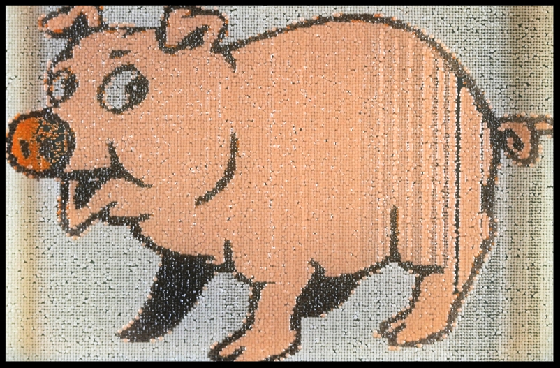 A pink pig printed with black, orange, white and pink pigment strains. 1536 biopixels. Printed by Leslie Mitchell. 