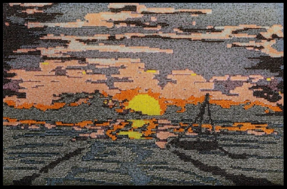 This image won the 2017 ASM Agar Art Competition. The piece was printed with ten yeast strains: black, white, RFP-pink, dark pink, light pink, purple, orange, yellow, gray, and blue. 24,576 biopixels! Designed and printed by Jasmine Temple.
